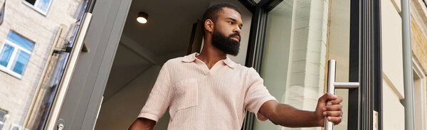 A stylish African American man explores a bustling urban area filled with excitement and diversity, banner