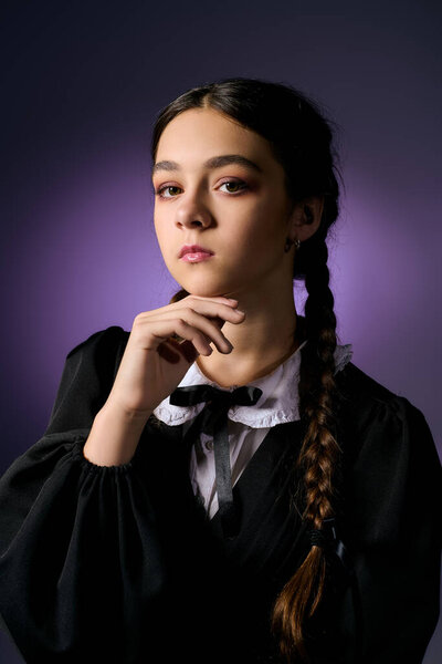 A girl with braids wears a gothic style dress, evoking a spooky Wednesday character for Halloween.