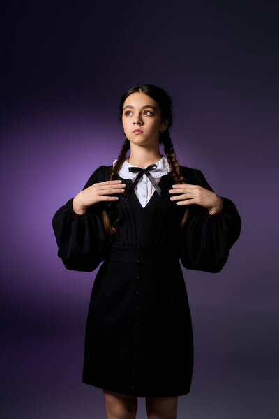 A girl with braids poses in a gothic dress, embodying the essence of Wednesday for Halloween.