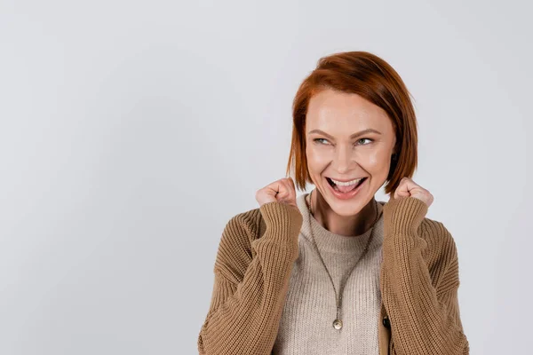 Excited redhead woman showing yes gesture isolated on grey — Foto stock