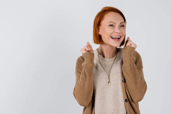 Cheerful red haired woman showing yes gesture isolated on grey — Foto stock