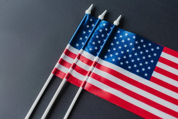 Top view of American flags with stars and stripes for memorial day isolated on black — Stock Photo