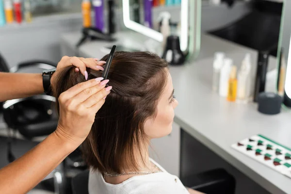 Salon job, beauty worker clipping hair of woman, professional hair clip, hairstyling, hair treatment, hairdo, extension, salon customer, beauty profession, client satisfaction, high angle view — Stock Photo