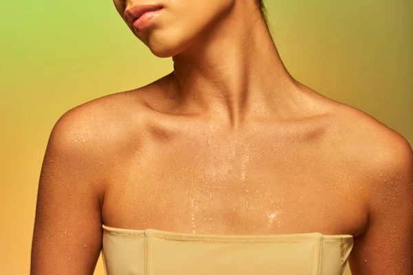 Hydration, cropped view of young woman with bare shoulders and wet body posing on gradient background, skincare campaign, beauty model, glowing skin, green background, natural beauty — Stock Photo