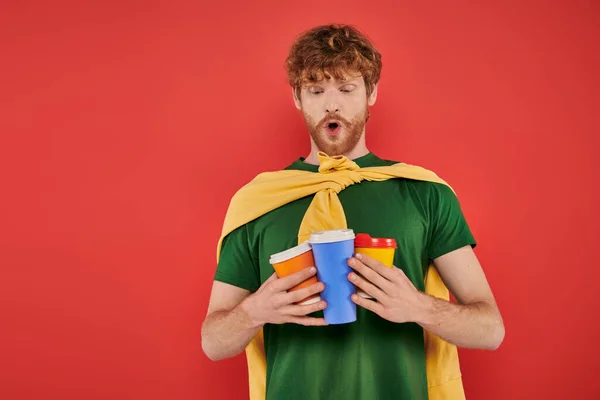 Morning energy, redhead and curly man holding paper cups with hot beverages, takeaway drink, energy and coffee, ginger, hipster, urban style, fashionable and trendy, lifestyle — Stock Photo