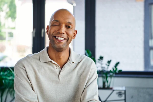 Professional headshots, cheerful dark skinned man with myasthenia gravis disease looking at camera, happy office worker with eye syndrome, inclusion and diversity — Stock Photo