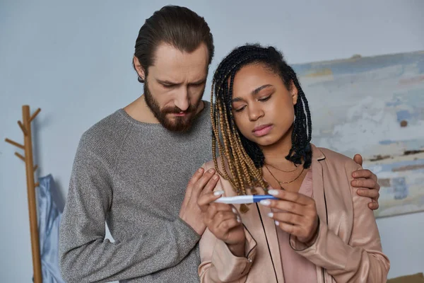 Abortion concept, african american woman and man looking at pregnancy test, making decision, stress — Stock Photo