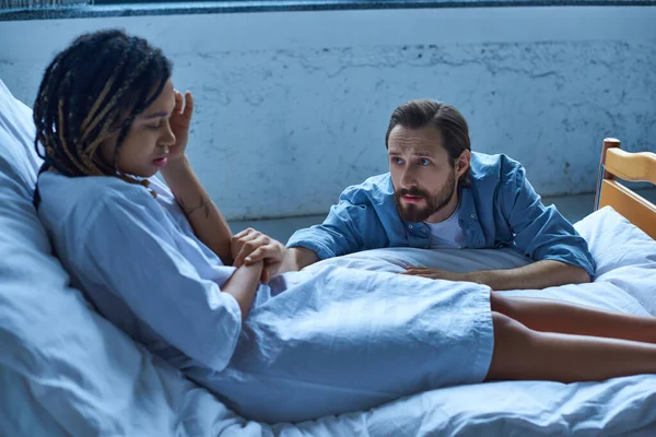 Miscarriage concept, sad man calming down depressed african american wife, hospital, private ward — Stock Photo