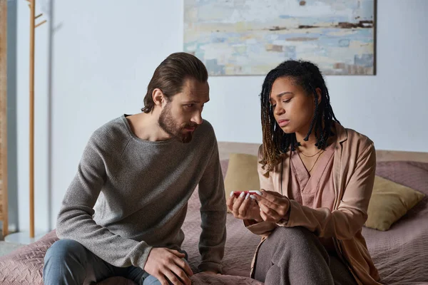 Abortion concept, african american woman holding pregnancy test near boyfriend, unexpected — Stock Photo