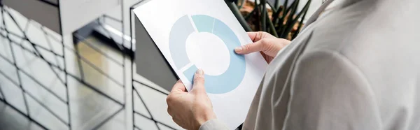 Mature businesswoman holding documents with infographics, business development, cropped view, banner — Stock Photo