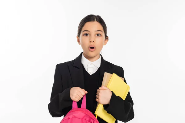 Schoolgirl in uniform reading book, student with brunette hair isolated on white, smart, education — Stock Photo