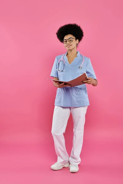 Breast cancer awareness, african american doctor, happy oncologist with folder, medical record — Stock Photo