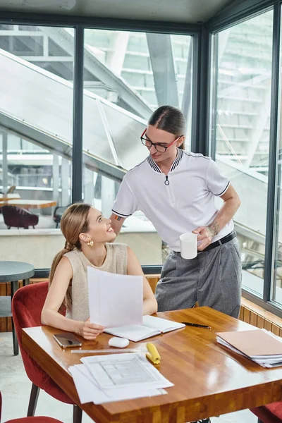 Two colleagues in smart casual wear working together smiling and looking at each other, coworking — Stock Photo