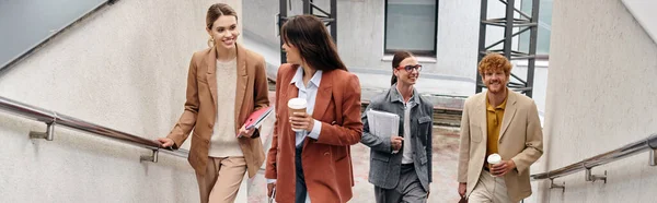 Smiley coworkers in smart casual outfits walking upstairs looking at each other, coworking, banner — Stock Photo