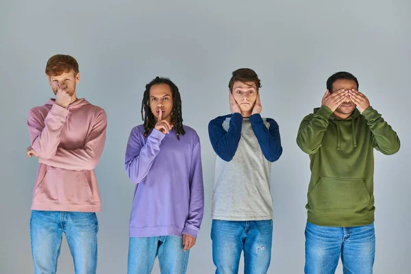 Four men showing gestures of four monkeys, hear, see, speak and do no evil, cultural diversity — Stock Photo