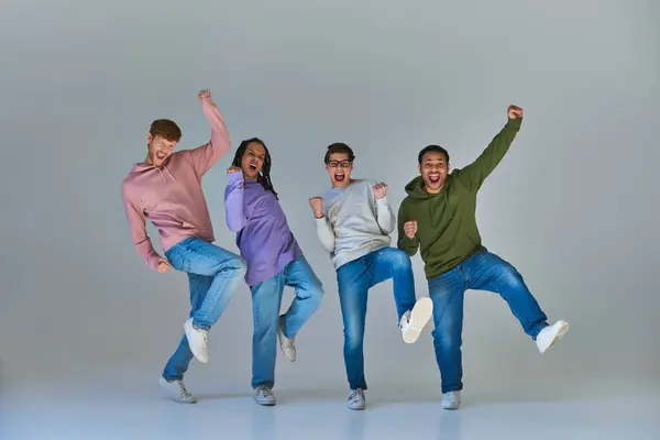 Multicultural happy friends in urban outfits jumping and having great time, cultural diversity — Stock Photo