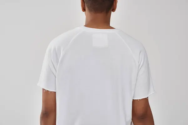 Fashionable african american male model in casual white t-shirt, copy space for advertising — Stock Photo