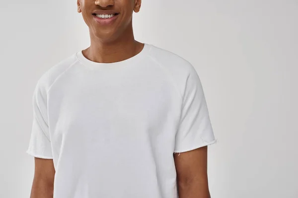 Fashionable african american male model in casual white t-shirt, copy space for advertising — Stock Photo