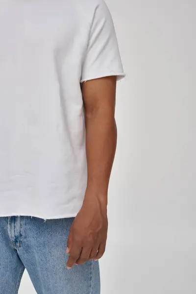 Stylish african american man in trendy casual jeans and white t-shirt, copy space for advertising — Stock Photo
