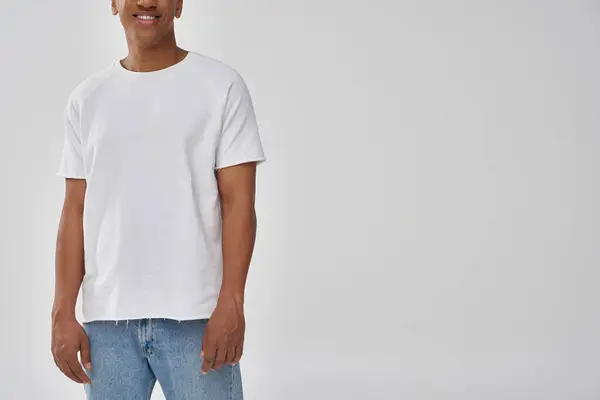 Stylish african american man in trendy casual jeans and white t-shirt, copy space for advertising — Stock Photo