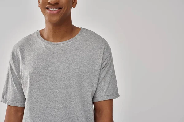 Fashionable young african american man wearing casual gray t-shirt, copy space for advertising — Stock Photo
