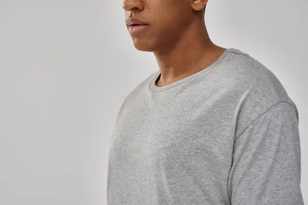 Fashionable young african american man wearing casual gray t-shirt, copy space for advertising — Stock Photo