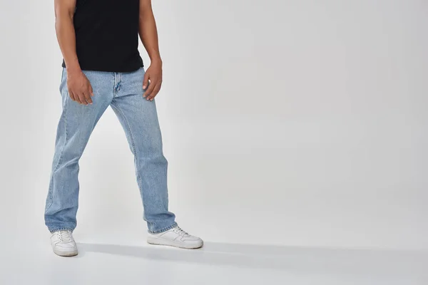 Stylish african american male model posing in black t-shirt and jeans, copy space for advertising — Stock Photo