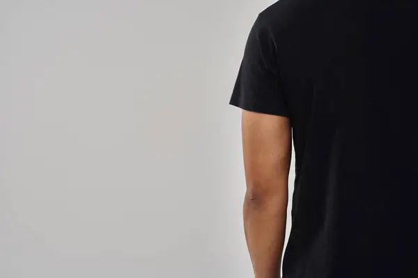 Fashionable african american man in casual stylish black t-shirt, copy space for advertising — Stock Photo