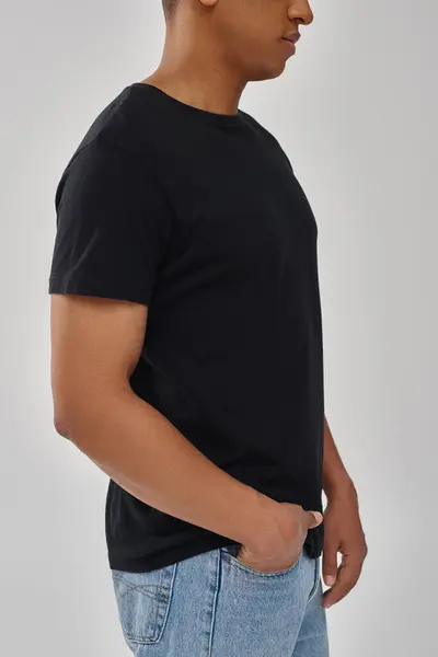 Stylish african american male model posing in black t-shirt and jeans, copy space for advertising — Stock Photo