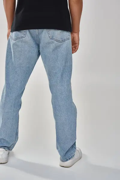 Stylish african american male model posing in black t-shirt and jeans, copy space for advertising — Stock Photo