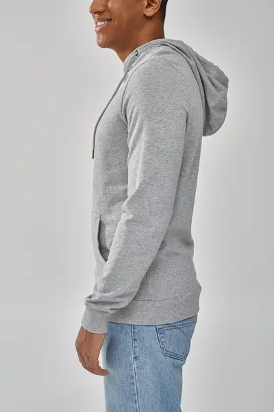 Stylish african american man in gray casual sweatshirt and jeans, copy space for advertising — Stock Photo