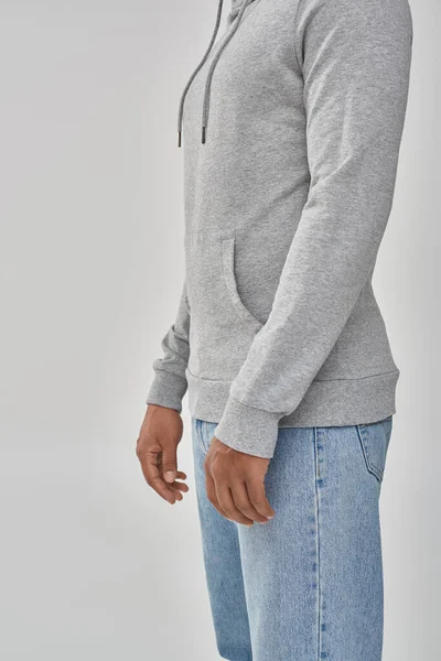 Stylish african american man in gray casual sweatshirt and jeans, copy space for advertising — Stock Photo