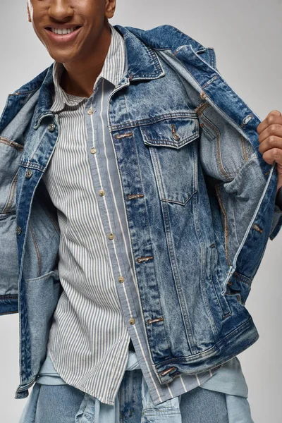 Cropped view of stylish african american male model posing in trendy denim outfit, fashion concept — Stock Photo