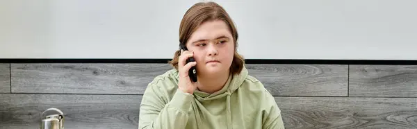 Young female client with down syndrome talking on mobile phone in modern cozy cafe, banner — Stock Photo
