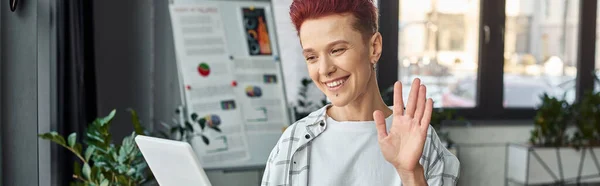 Happy bigender manager waving hello during video call on digital tablet in modern office, banner — Stock Photo