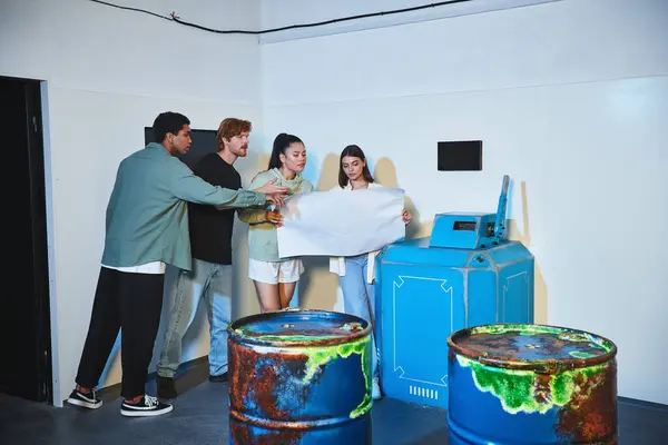 Group of interracial friends holding blueprint and talking during quest in escape room, brainstorm — Stock Photo
