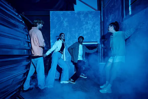 Multicultural group of young friends inside of quest room during escape adventure, teamwork — Stock Photo
