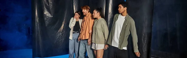 Group of scared interracial friends standing inside of escape room during quest, banner — Stock Photo