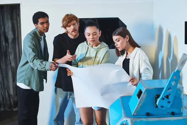Group of young interracial friends looking at blueprint and planning escape in quest room, puzzle — Stock Photo