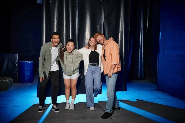 Four young interracial friends celebrating success in an escape room challenge, rejoice and fun — Stock Photo