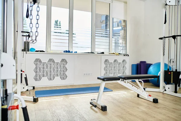 Various rehabilitation equipment in spacious gym of kinesiology center, modern advanced medicine — Stock Photo