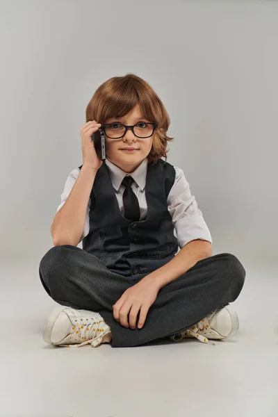 A young boy exudes confidence and professionalism as he talking on his phone, future businessman — Stock Photo