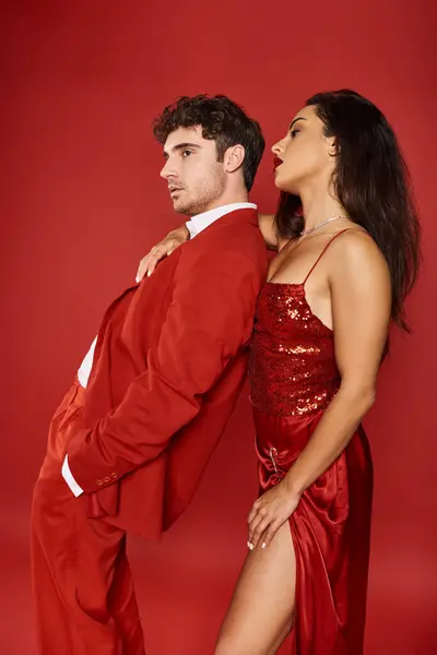 Side view of beautiful young woman with red lips embracing good looking man on Valentines day — Stock Photo
