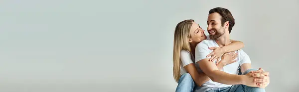 A passionate moment between a man and woman as they hold each other tightly in a loving embrace, banner — Stock Photo