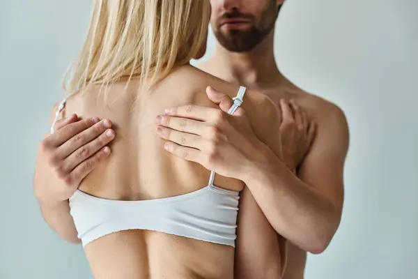 A man in an intimate moment, holding a woman in a tender embrace, showing their deep romantic connection. — Stock Photo