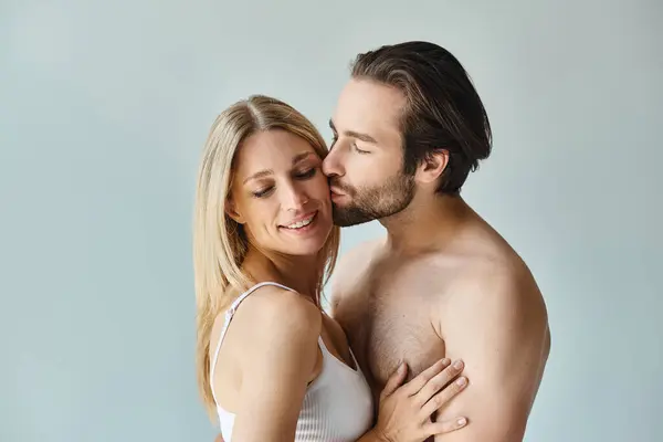 A passionate moment captured, a man and woman holding each other closely in a romantic embrace. — Stock Photo
