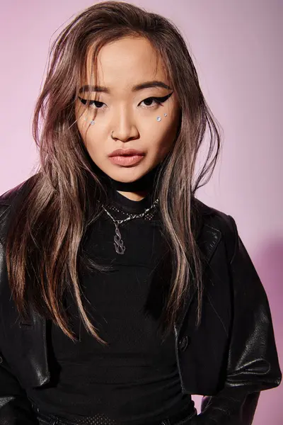 Portrait of attractive asian young woman with heavy makeup against lilac background — Stock Photo