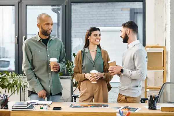 A diverse group of professionals standing around a table, engaged in discussions, brainstorming ideas for a project together. — Stock Photo