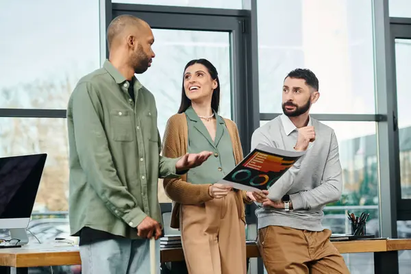A team of professionals collaborating on a project, standing around in a modern office space with a corporate vibe. — Stock Photo