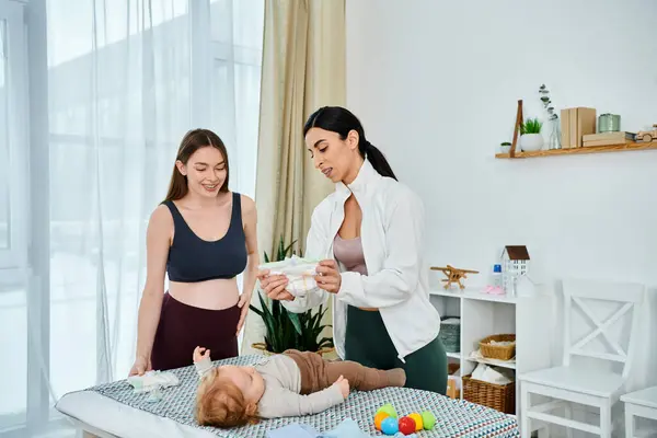 A young mother stands vigilantly over her sleeping baby on the bed, guided by her parenting coachs teachings. — Stock Photo